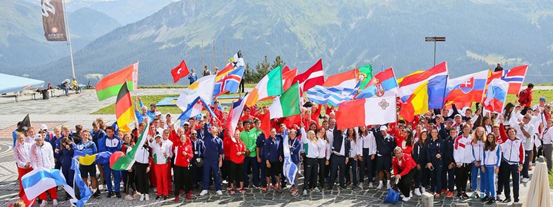 Large group of people waving different national flags