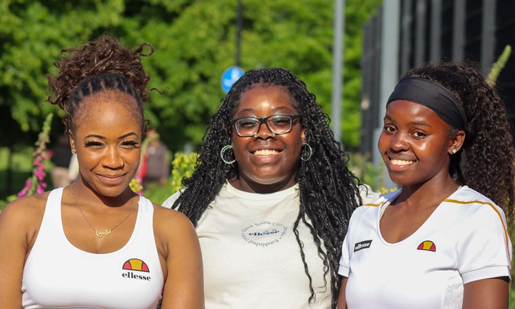 Tennis coaches and SheCanServe co-founders Memuna Koroma (L), Rushan Tonge-Bobia, and Angela Zamara (R) pictured during a SheCanServe event.