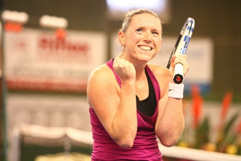 Naomi Cavaday smiling with tennis racket in hand