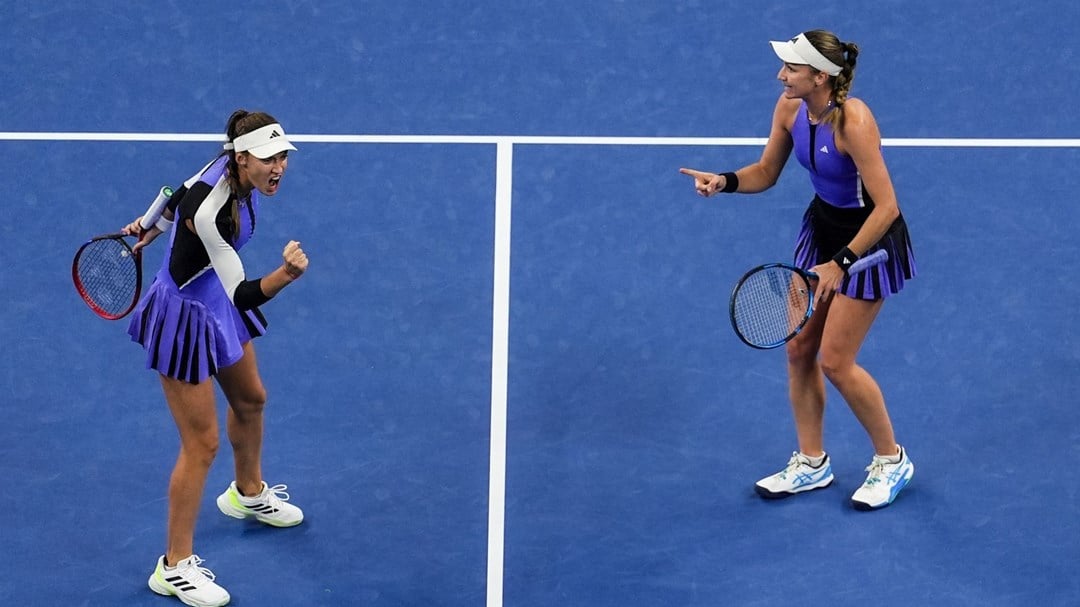 British tennis player Olivia Nicholls and doubles partner Tereza Mihalikova celebrating with each other on court at the China Open