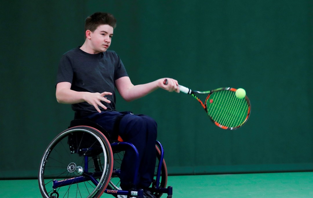 Ruairi Logan hitting a forehand