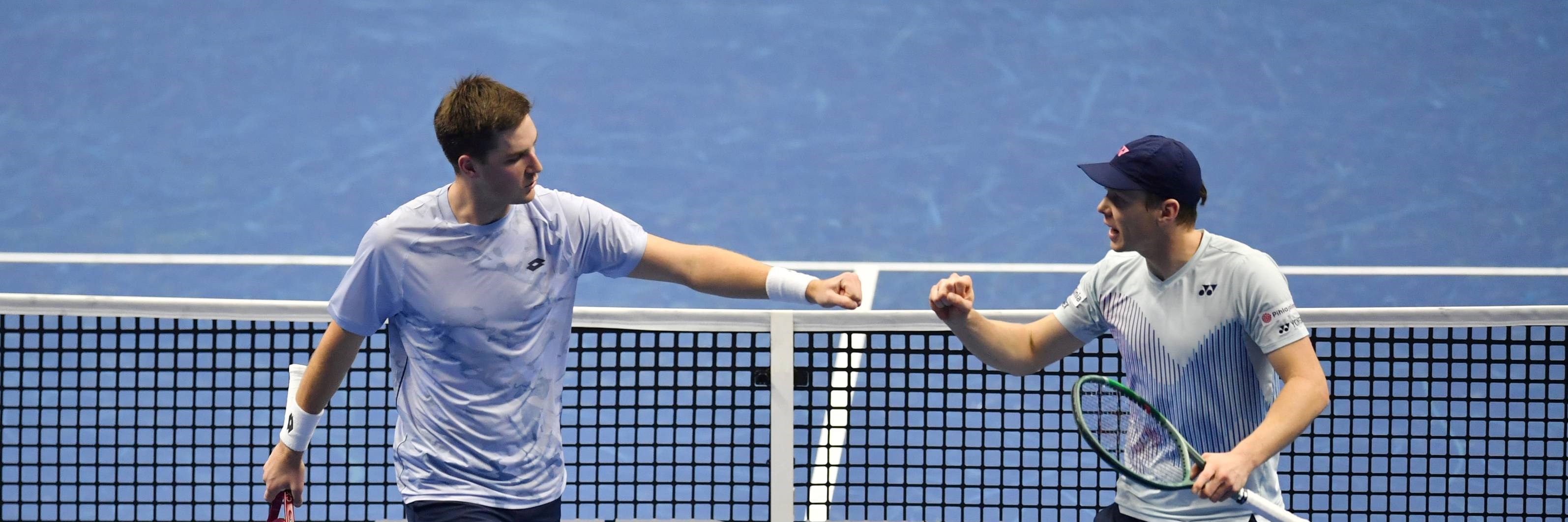 Henry Patten and Harri Heliovaara fist bump in their first match at the Nitto ATP Finals