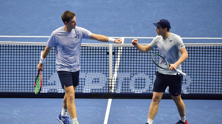 Henry Patten and Harri Heliovaara fist bump in their first match at the Nitto ATP Finals