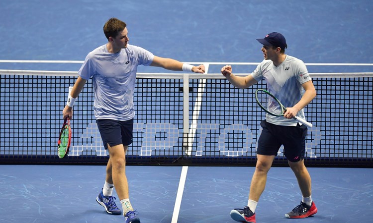 Henry Patten and Harri Heliovaara fist bump in their first match at the Nitto ATP Finals