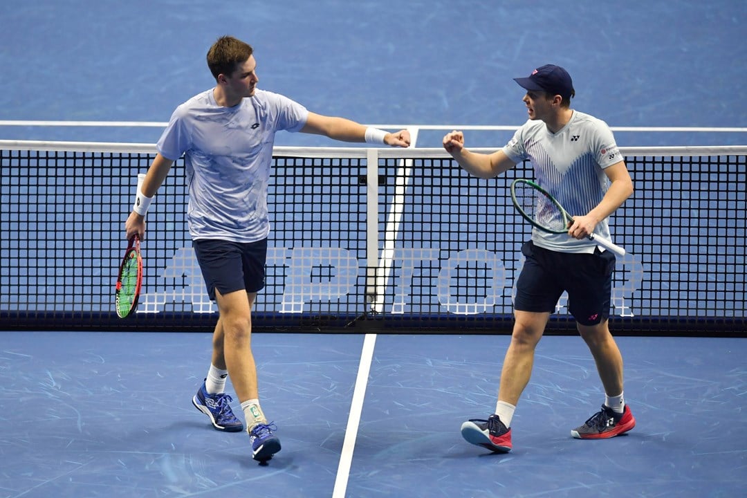 Henry Patten and Harri Heliovaara fist bump in their first match at the Nitto ATP Finals