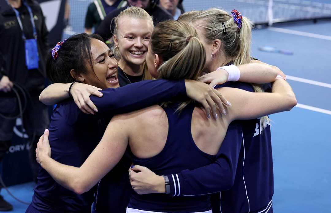 The Bille Jean King Cup squad hug after defeating Spain to reach the semi-finals