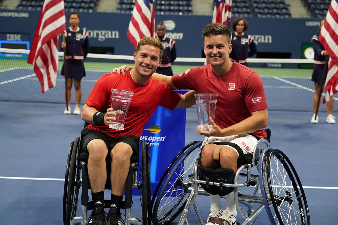 Hewett and Reid smiling holding their trophies