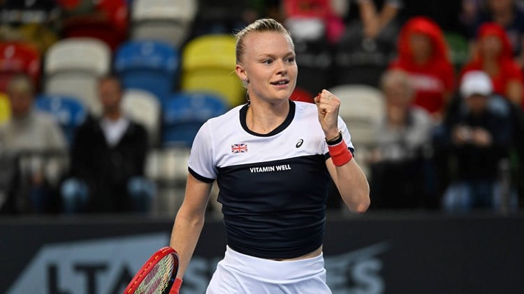 British tennis player Harriet Dart clenching her fist on court at the Billie Jean King Cup Play-off tie against Sweden