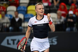 British tennis player Harriet Dart clenching her fist on court at the Billie Jean King Cup Play-off tie against Sweden