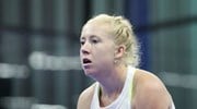 A close up picture of British Padel player Lisa Phillips  wearing a white top with a flag of Great Britain