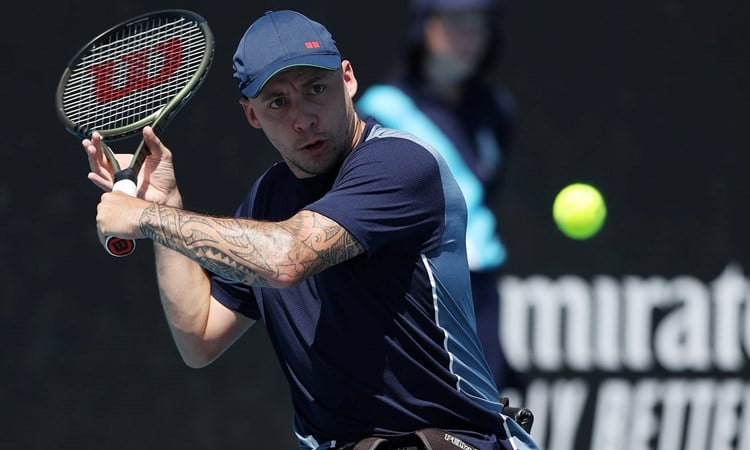 British quad tennis player Andy Lapthorne preparing to hit a backhand slice on court at the 2024 Australian Open