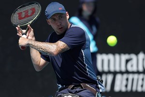 British quad tennis player Andy Lapthorne preparing to hit a backhand slice on court at the 2024 Australian Open