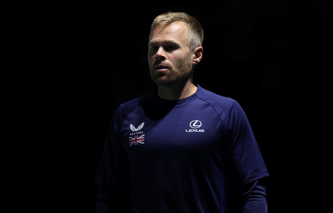 LTA Tennis Coach Mark Hilton wearing a Castore and Lexus branded t-shirt with a logo of the Great Britain flag while on court at the Davis Cup in Manchester