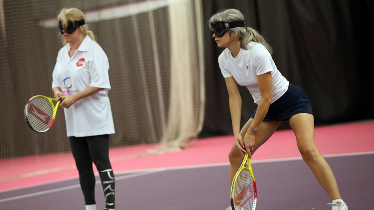 Visually impaired tennis players in action 