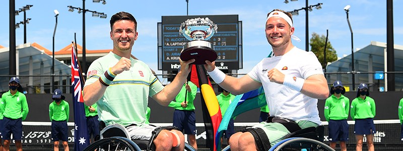 Alfie Hewett and Gordon Reid holding a trophy together