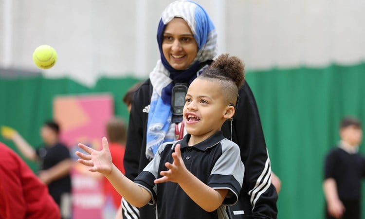 Young kid playing tennis at an LTA Tennis Foundation festival