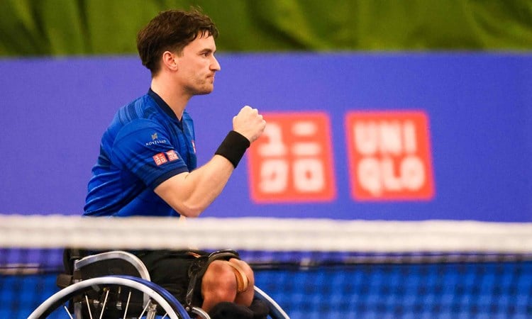 British wheelchair tennis player Gordon Reid clenching his fist on court at the Wheelchair masters after reaching the men's singles final