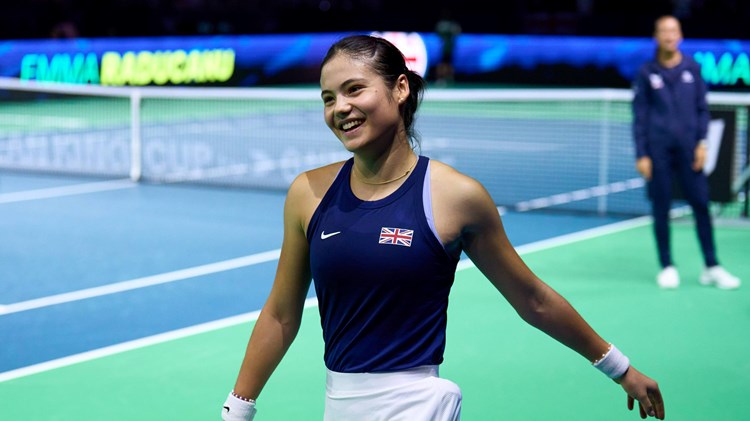 Emma Raducanu smiling on court after winning her match against Canada at the Billie Jean King Cup