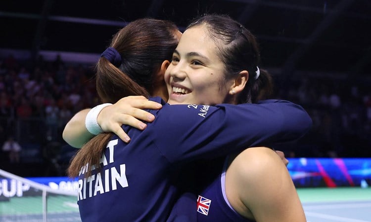 Emma Raducanu and Anne Keothavong hug after Great Britain beat Canada at the Billie Jean King Cup