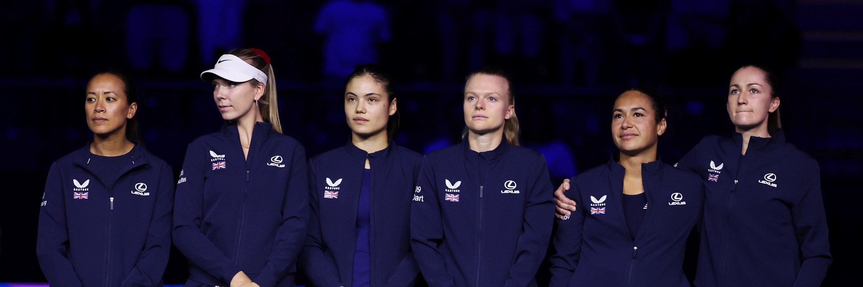 The Lexus Great Britain Billie Jean King Cup team (Anne Keothavong, Katie Boulter, Emma Raducau, Harriet Dart, Heather Watson and Olivia Nicholls) holding their flags and lined up next to each other ahead of their Billie Jean King Cup Finals semi-final match against Slovakia