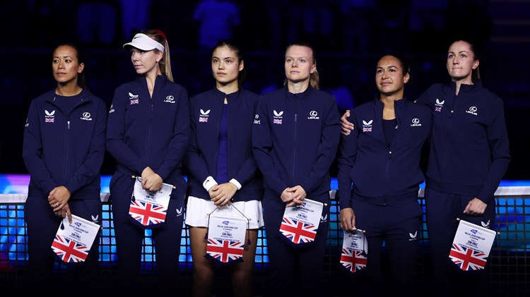 The Lexus Great Britain Billie Jean King Cup team (Anne Keothavong, Katie Boulter, Emma Raducau, Harriet Dart, Heather Watson and Olivia Nicholls) holding their flags and lined up next to each other ahead of their Billie Jean King Cup Finals semi-final match against Slovakia