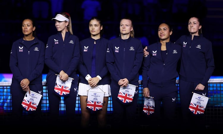 The Lexus Great Britain Billie Jean King Cup team (Anne Keothavong, Katie Boulter, Emma Raducau, Harriet Dart, Heather Watson and Olivia Nicholls) holding their flags and lined up next to each other ahead of their Billie Jean King Cup Finals semi-final match against Slovakia