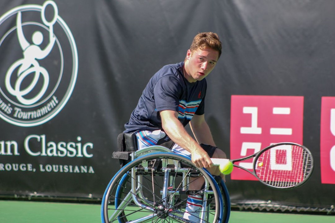 Alfie Hewett in action taking backhand shot