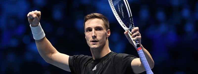 joe salisbury on court celebrating with hand in the air