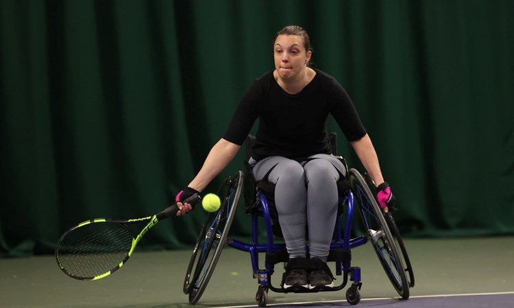 Wheelchair tennis player Naomie Traver reaching for a forehand t the Lexus Wheelchair National Finals