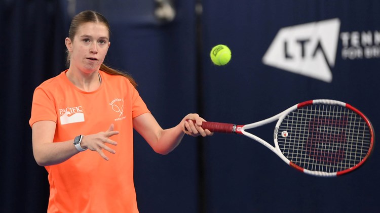 Para standing tennis player Georgia Routledge lines up a forehand