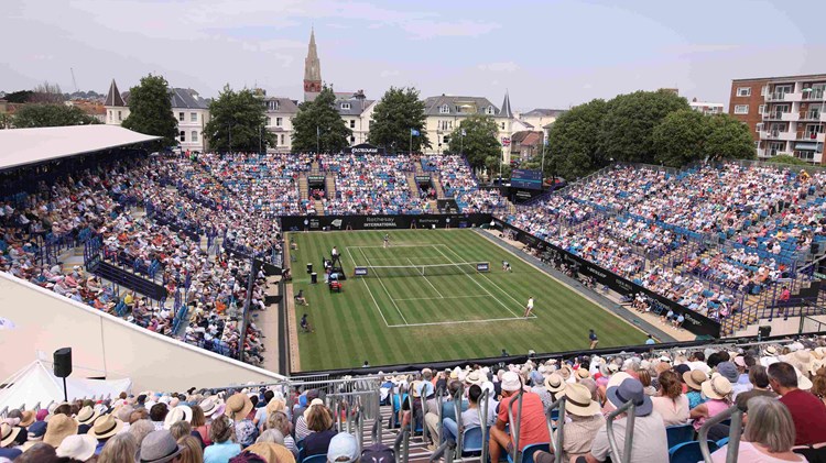 General view of tennis fans watching on court at the Rothesay International Eastbourne with the sun going down