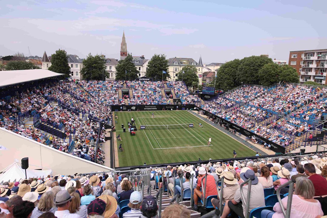 General view of tennis fans watching on court at the Rothesay International Eastbourne with the sun going down