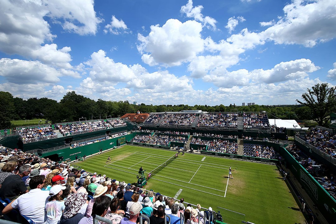 Grass court stadium filled with fans