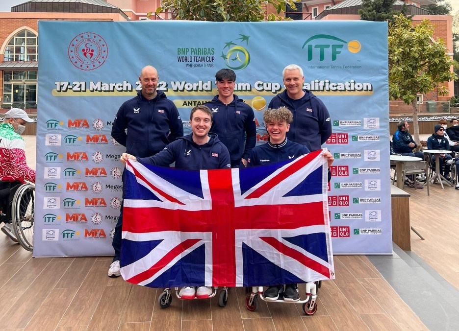 Paralympic players holding Great Britain flag