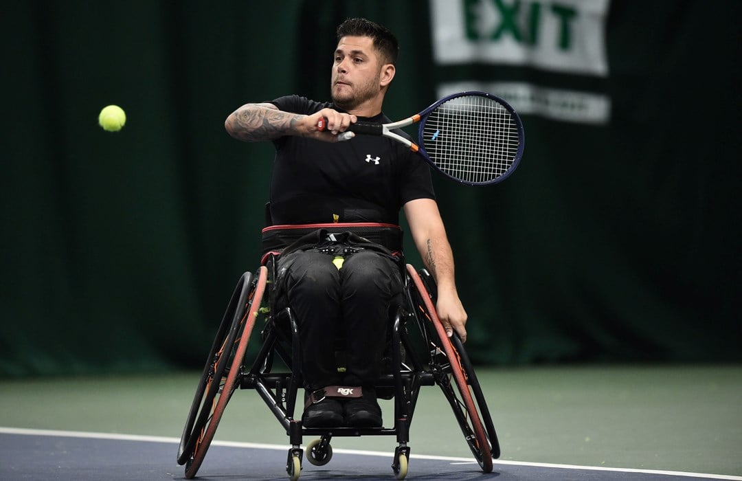 Gary Cox plays a shot to Tony Heslop in the mens singles match during the LTA Wheelchair National Finals at The Shrewsbury Club on November 27, 2021 in Shrewsbury, England.