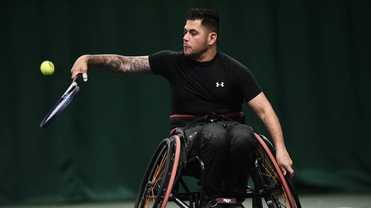 Gary Cox returning a backhand during the Quand singles final at the 2022 LTA Wheelchair Tennis National Finals
