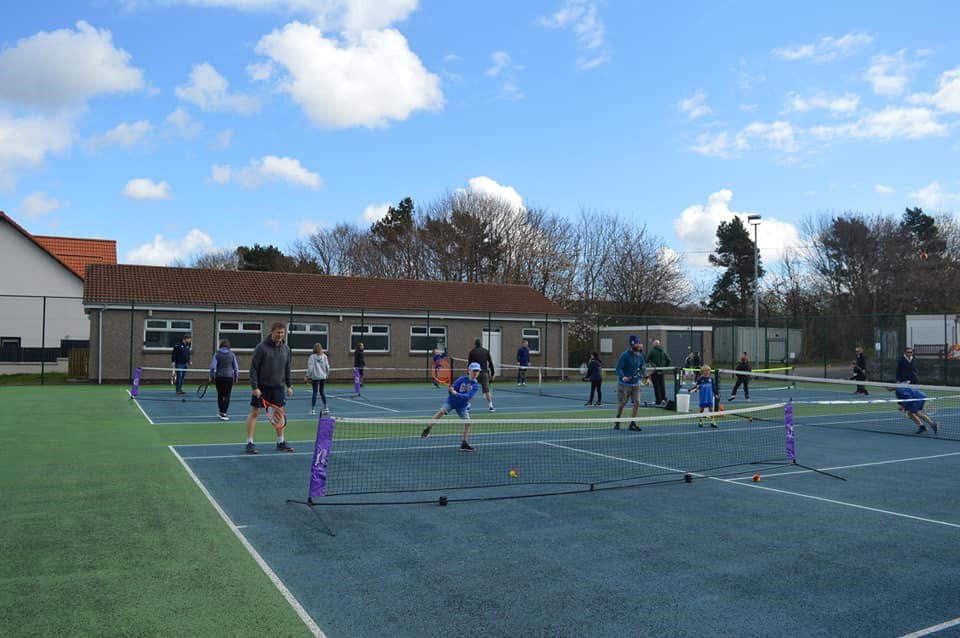Both parents and kids taking part in a 12-hour Tennisathon to celebrate the opening of Longniddry Tennis Club