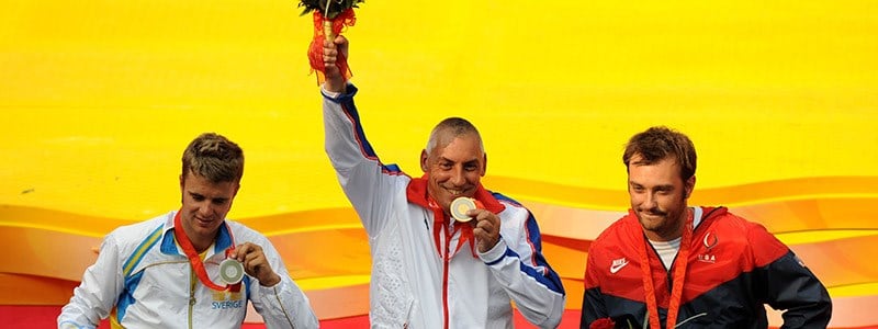 Three tennis players celebrating their victory