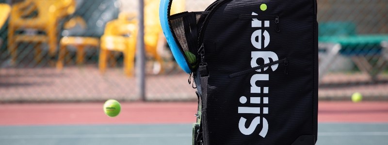 Close up of a Slinger bag on a tennis court