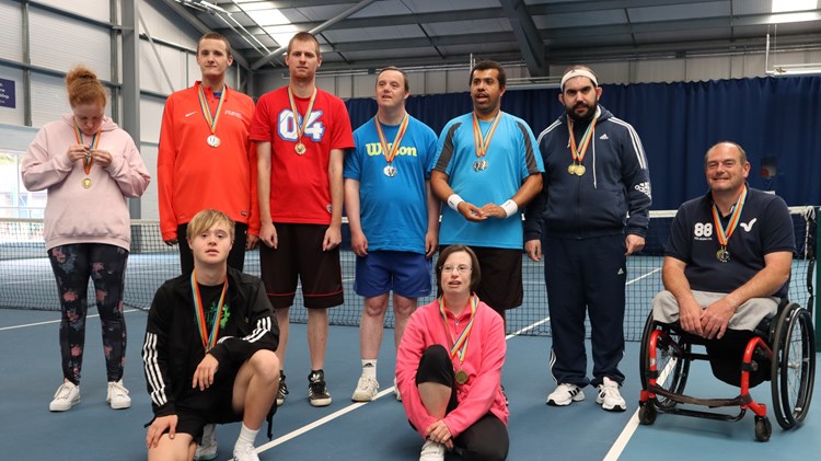 Grantham Tennis Club coach Paul Singleton pictured with his the learning disability players at Grantham Tennis Club