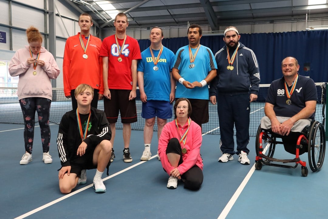 Grantham Tennis Club coach Paul Singleton pictured with his the learning disability players at Grantham Tennis Club