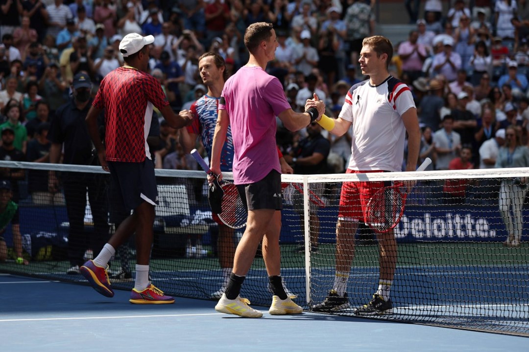 Joe Salisbury and Rajeev Ram shake hands with Neal Skupski and Wesley Koolhof in the US Open final