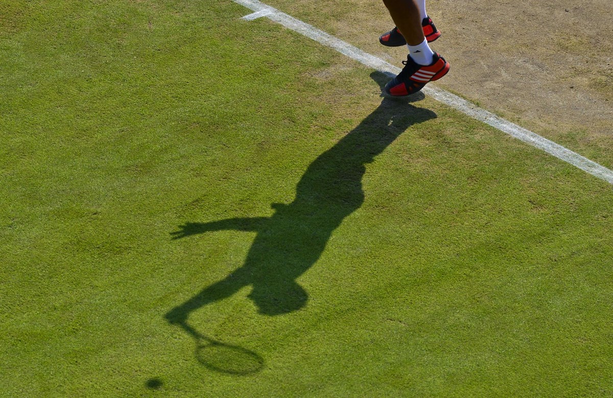 Player shadow on grass court.jpg