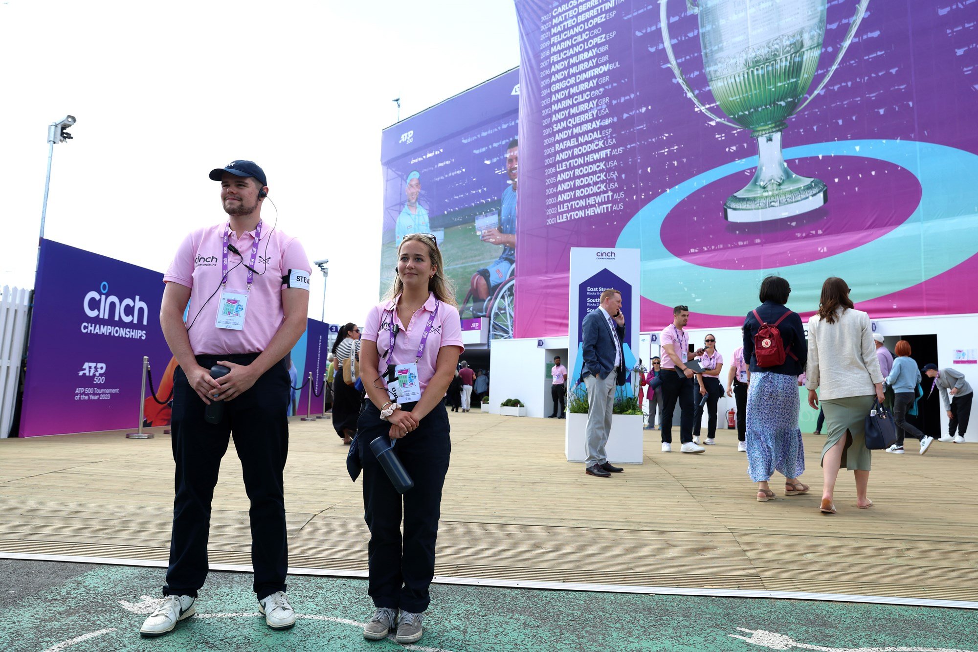 Two Stewards standing, ready to help someone inside The Queen's Club