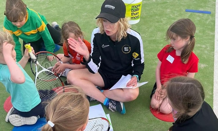 Coach Emily James pictured delivering a Prime Video LTA Youth Girls session.