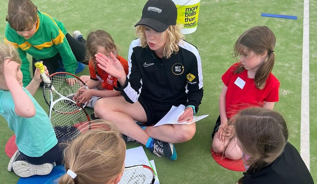 Coach Emily James pictured delivering a Prime Video LTA Youth Girls session.