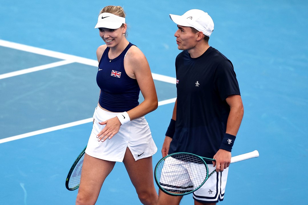 Katie Boulter and Charles Broom laughing together on court at the United Cup